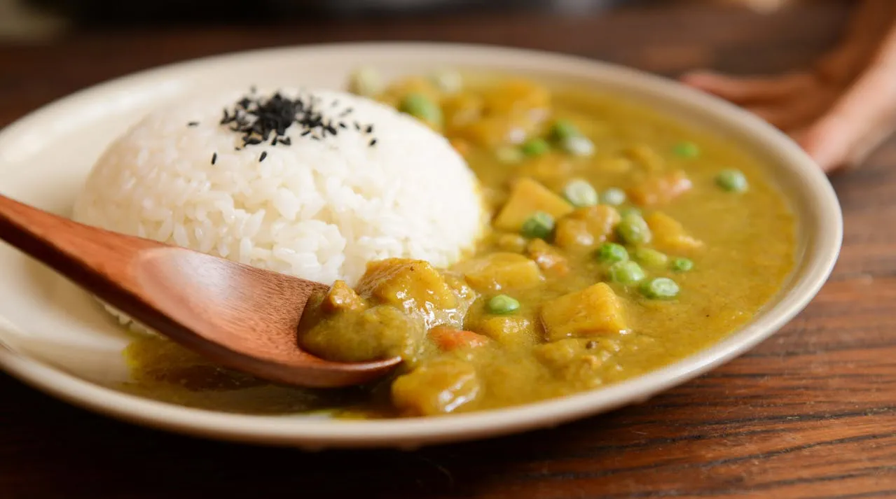 A photo of Cooked Rice & Curry